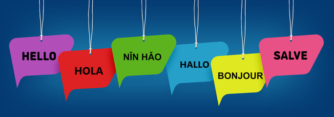 Paper speech bubbles with greetings in different languages hanging on dark blue background. Banner design © New Africa