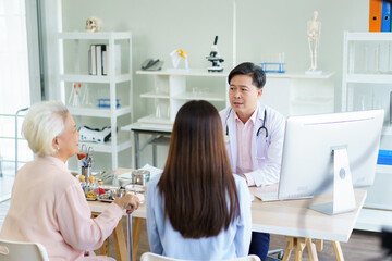 Elder woman and man have a consulting with doctor.