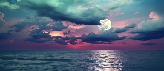 Super moon. Colorful sky with cloud and bright full moon over seascape in the evening, Moonlit Ocean Landscape