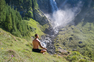 Meditation. Harmony and peace in nature. Calm athlete man meditating in environment. Mindfulness. Relaxed man in nature. Freedom and happiness. Man practicing yoga outdoors.