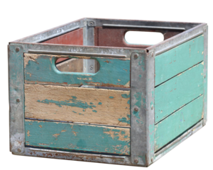 An old weathered crate in teal colors with metal corners.