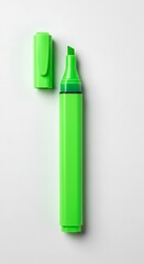 A vibrant green highlighter with its cap off sits on a clean white background, ready to add emphasis to text or other important information.