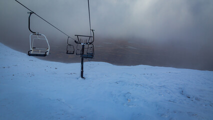  Ride Over Glencoe’s Snowy Slopes | Highland Winter Views A snowy decent down Glencoe’s ski slopes offers stunning views of snow-blanketed peaks and remote Highland landscapes, captured from the ski l