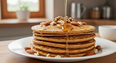 Stack of pancakes with honey and nuts