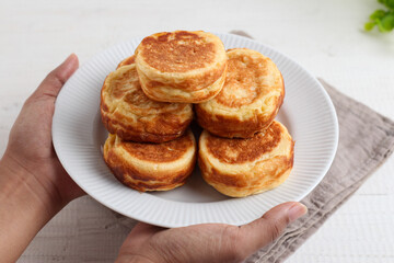 Kue Kamir. Kamir cake. served on a white plate. with copy space. originated from Pemalang, Middle Java, Indonesia.