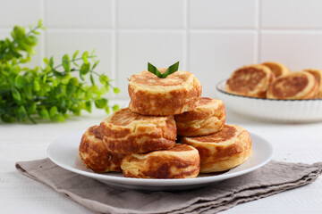 Kue Kamir. Kamir cake. served on a white plate. with copy space. originated from Pemalang, Middle Java, Indonesia.