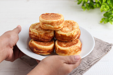 Kue Kamir. Kamir cake. served on a white plate. with copy space. originated from Pemalang, Middle Java, Indonesia.