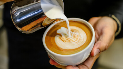 Latte Art Creation Pouring Milk into Espresso