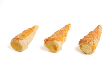 Kue cumcum. Horn pastry or cone pastry with vanilla cream. isolated on white background.