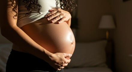Pregnant woman holding her belly
