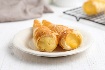 Kue cumcum. Horn pastry or cone pastry with vanilla cream.