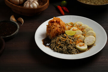 Lontong kupang, or rice cake with small white clams. traditional food of east java, indonesia.