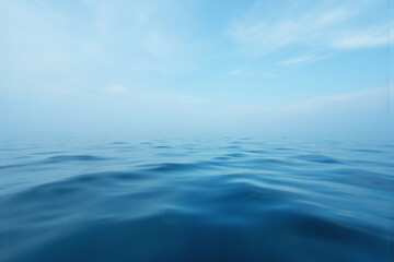 Fototapeta premium blurry image of the ocean with a blue sky in the background