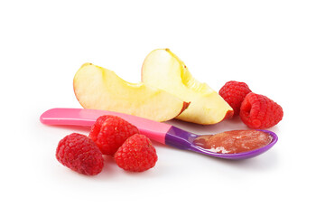 Baby food. Tasty puree in spoon, apple and raspberries isolated on white