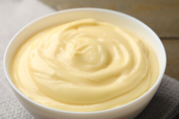 Tasty vanilla pudding on wooden table, closeup