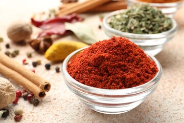 Different aromatic spices on color textured table, closeup