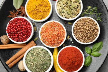 Different aromatic spices on table, top view