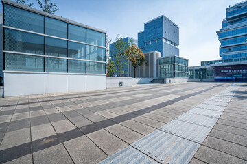 Fototapeta premium modern business office buildings with empty road,empty concrete square floor 