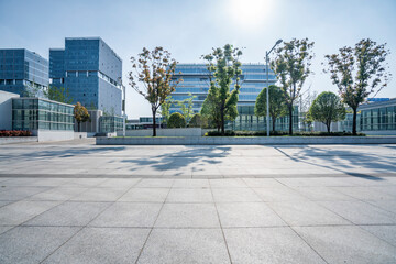 modern business office buildings with empty road,empty concrete square floor	
