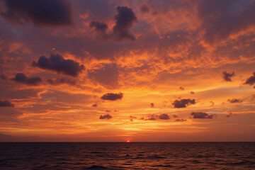 Fototapeta premium colorful sunset over the ocean with clouds in the sky1