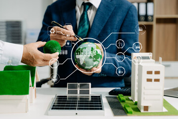 Business team people planning hand using laptop for working technology and business Net zero and...