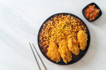 Korean instant noodles with fried chicken or Fried chicken ramyeon