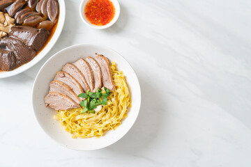 dried duck noodles in white bowl