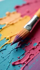 Fototapeta premium Close up of paintbrush resting on textured paper with bristles and paint traces, brush, tool, craft