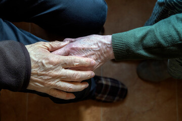 Close-Up of Elderly Hands Holding in Comforting and Supportive Gesture