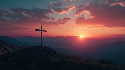Fototapeta premium Cross silhouette on a hilltop set against a vibrant sunset horizon over mountains
