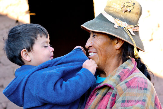 Happy multiracial family - toddler with his grandmother.