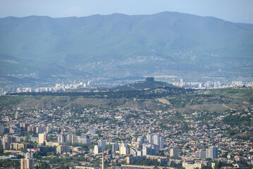 Cityscape of Tbilisi, the capital of Georgia, aerial panoramic view from Mtatsminda Park