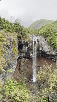 stunning Mangawhero Falls overlooking powerful  snow covered Ruapehu volcano - Gollum's Pool & Ithilien in tongariro national park, North Island, New Zealand


