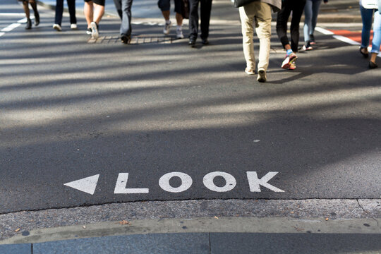 Look sign on a road at a busy intersection in the Sydney CBD