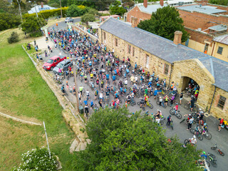 Hundreds of cyclist waiting in front of an historical buildings