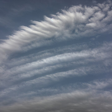 Veil of Cirrostratus Over Rolling Clouds