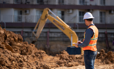 Construction engineer working construction site for survey inspection detail of construction with...