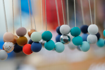 Beaded necklaces hanging at a market stall