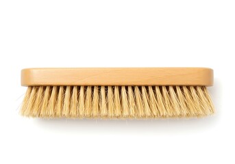 Close up of a light brown wooden brush with soft bristles on a white background surface view flat lay