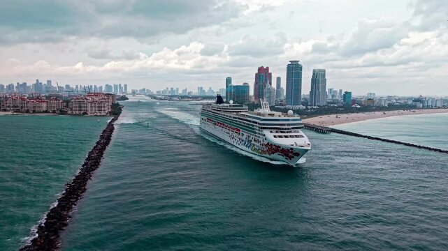 Miami, Florida, USA - March 12, 2025: Norwegian Gem cruise ship voyage. Cruise in summer vacation. Norwegian cruise line. Cruise ship tour travel at sea. Ship leaving Miami beach port. Ocean voyage