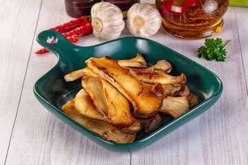Roasted eringi mushrooms in the plate
