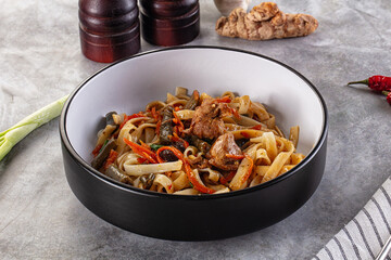 Asian cuisine udon with chicken and vegetables