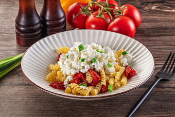 Italian pasta fusili with curd