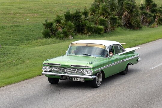 Green Chevrolet Impala 1959 sedan in Varadero, Cuba with white roof