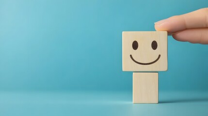 Obraz premium Hand Placing Wooden Happy Face Block, Concept of Customer Experience and Satisfaction
