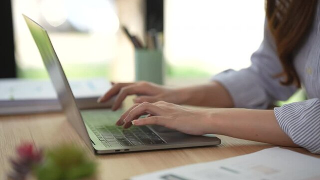 Asian woman hands typing on computer keyboard. Close up panoramic banner. Businesswoman or learner using laptop at home. Online learning, Internet marketing, Working from home, Office work, Freelance 