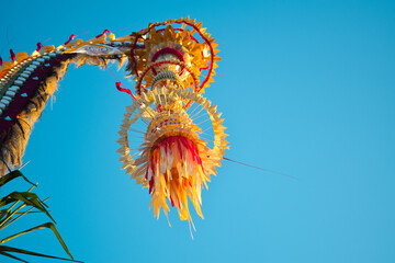Close up of a penjor traditional bali celebration made from bamboo and coconut leaves