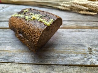Black bread, homemade rye bread on wooden background. Healthy eating.