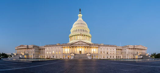 Panorama of the illuminated U.S. Capitol Building in Washington D.C. at dawn