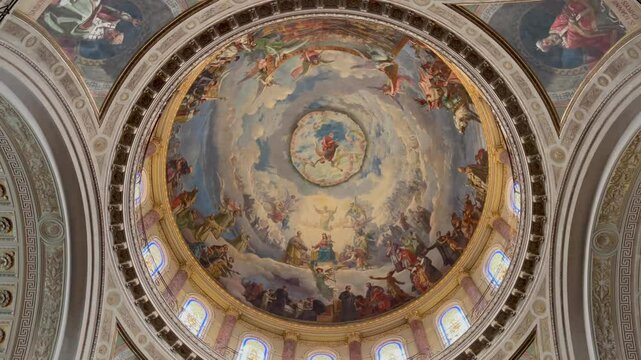 Magnificent fresco painting on the dome of Basilica di Maria Ausiliatrice in Turin, Italy, featuring religious scenes, vivid colors, and classical architecture details.